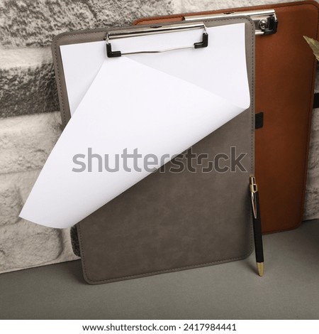 Colorful leather clipboard. Genuine leather clipboard, concept shot, top view, different color, clamshell and stitched clipboard
