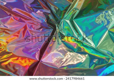 Trendy holographic background. Iridescent foil texture. Metallic backdrop Royalty-Free Stock Photo #2417984661