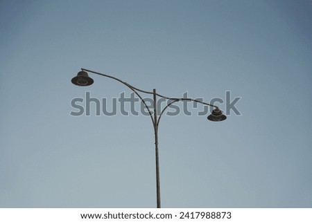 A street lamp against the blue sky. Industrial photography of a street lamp.