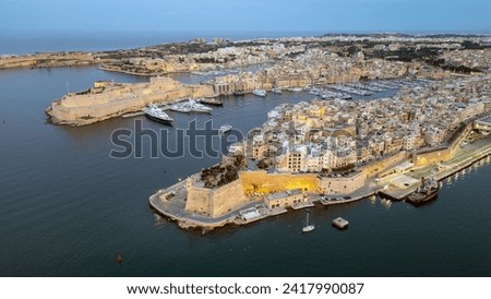 Twilight over Valletta: Aerial View of the Historic City Skyline with Illuminated St. Paul's Pro-Cathedral and the Grand Harbour - Malta