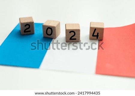2024, France, France flag with date block, Concept, Important events for France in the new year, election, economy, social activities, central bank, France foreign policy