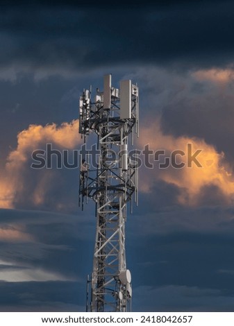 gsm antenna device in white on sky background mobile telephony in spain Royalty-Free Stock Photo #2418042657