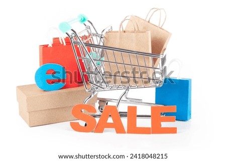 Shopping cart with paper bags and 'Sale' sign on a white background. Ideal for sale advertising, promotional banners and announcements design.