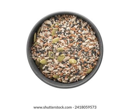 Top view of seed mix for salad in black bowl isolated on white background Royalty-Free Stock Photo #2418059573