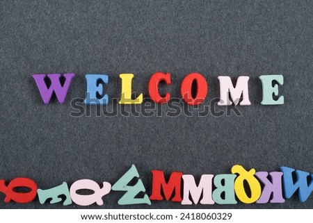 word on black board background composed from colorful abc alphabet block wooden letters, copy space for ad text. Learning english concept
