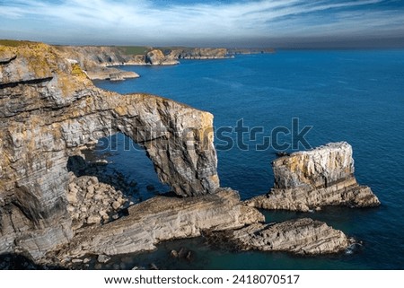 Rock Formation Green Bridge At The Atlantic Coast Of Wales In Pembrokeshire, United Kingdom Royalty-Free Stock Photo #2418070517