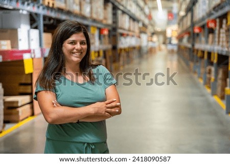 Portrait of woman customer or store worker with shelves in storage as background. High quality photo