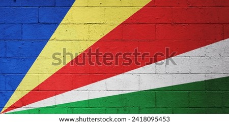 Flag of the Seychelles painted on a brick wall.