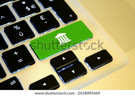 Close up on a green key with a white stock exchange sign on it.