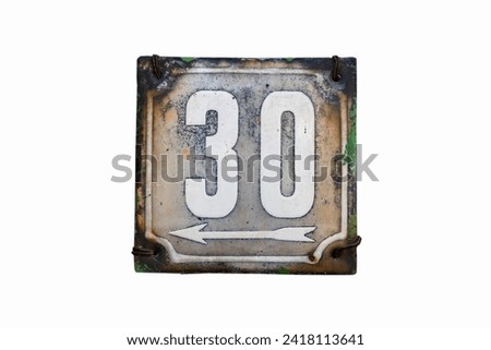 Weathered grunge square metal enameled plate of number of street address with number 30 isolated on white background