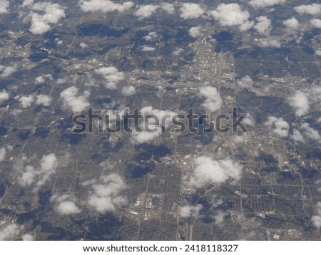 Medium close up, aerial view approaching the international airport of Houston, Texas  from an airplane window.