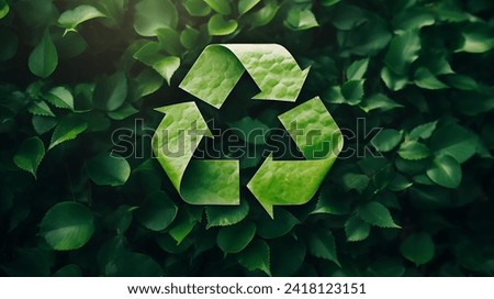 A symbol of waste recycling with green leaves. Environmental protection concept with leaves background. A top view of a recycling symbol covered by green paper. Save planet, eco, recycling concept  Royalty-Free Stock Photo #2418123151