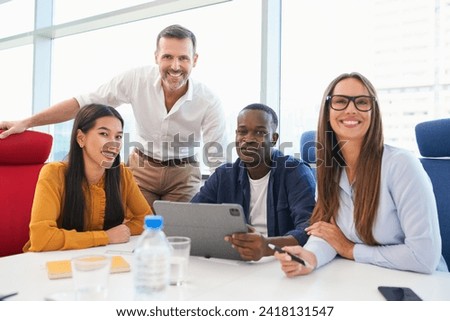 Portrait of successful business team during informal meeting at office Royalty-Free Stock Photo #2418131547