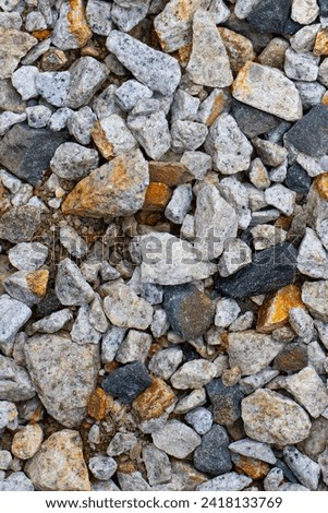Different size multi-colored gravel  stone background. Royalty-Free Stock Photo #2418133769