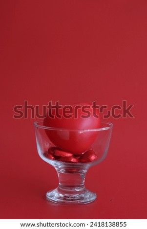 Red Hearts in a Transparent Glass , Red Background