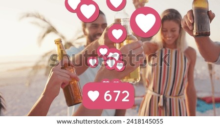 Image of heart icons and numbers over friends making toast with beer bottles on beach. digital interface, social media and global technology concept digitally generated image.