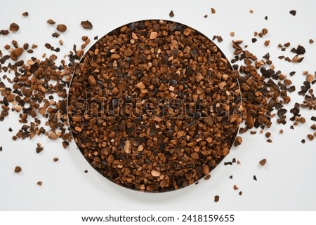 Organic pure Guarana Dried Seeds on white background top view stock images. Guarana seeds coarse cuts. 