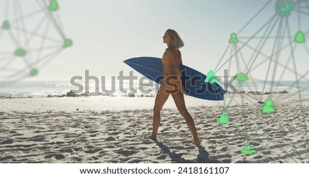 Image of networks of connections with icons over woman with surfboard on beach. digital interface, social media and global technology concept digitally generated image.