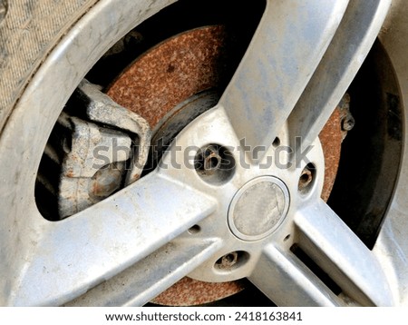 cut disc brake lining. parking for a long time in one place took its toll on condition of vehicle, which had to replace the brakes. car service advertisement and warning for drivers who rarely drive