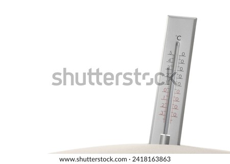 Weather thermometer in sand against white background Royalty-Free Stock Photo #2418163863