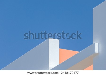 architectural photography. Abstract architecture background. Modern white concrete structure with straight lines and geometric shapes, against a blue sky. geometrical, linear design concept. Minimal Royalty-Free Stock Photo #2418170177