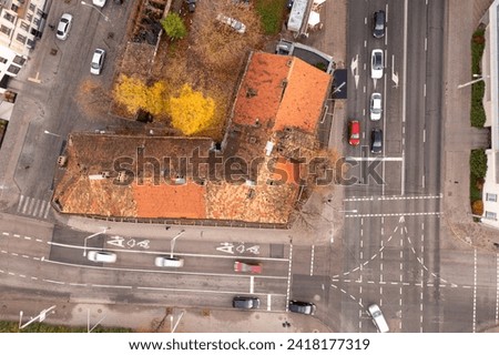 Drone photography of city downtown district and sidewalk being repaired during autumn sunny day