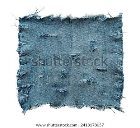 Piece of torn denim on a white background. Denim texture Royalty-Free Stock Photo #2418178057