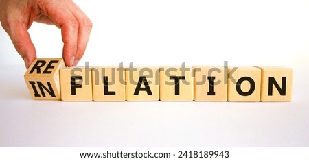 Reflation or inflation symbol. Concept word Reflation Inflation on beautiful wooden cubes. Beautiful white table white background. Businessman hand. Business reflation or inflation concept. Copy space