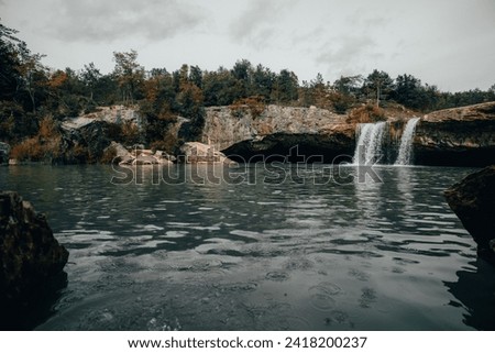 Zarecki krov, a beautiful dinaric rock cascade formation with waterfall in central istria. Hidden beach under a rock on a cloud summer day.