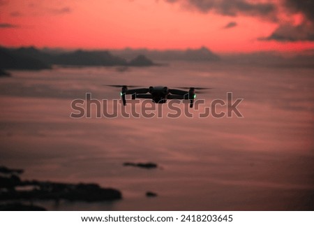 Drone in front of sunrise in Norwegian mountains Royalty-Free Stock Photo #2418203645