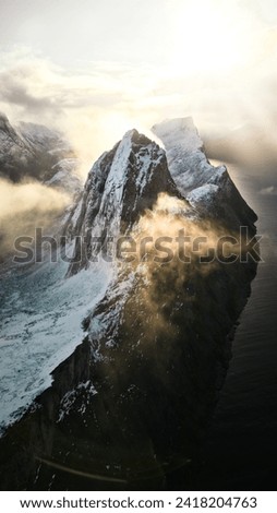 Segla Mountain and clouds in Norway Royalty-Free Stock Photo #2418204763