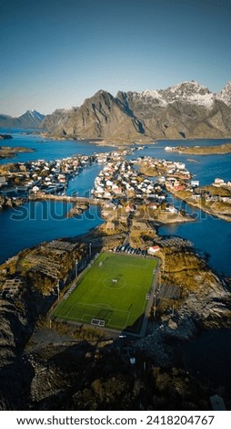 Buildings and soccer field in Henningsvær, Norway Royalty-Free Stock Photo #2418204767
