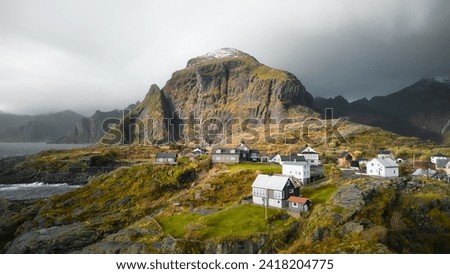Houses and mountains in Å, Norway Royalty-Free Stock Photo #2418204775