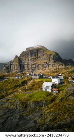 Houses and mountains in Å, Norway Royalty-Free Stock Photo #2418204795