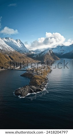 Island and mountains in Norwegian fjord Royalty-Free Stock Photo #2418204797
