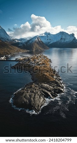 Island and mountains in Norwegian fjord Royalty-Free Stock Photo #2418204799