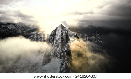 Segla Mountain and clouds in Norway Royalty-Free Stock Photo #2418204807