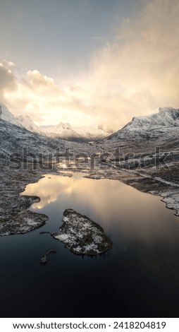 Sunset and reflection in Norwegian Mountains Royalty-Free Stock Photo #2418204819