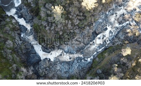 rocky river in the mountains aerial drone