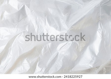 Processed collage of transparent cellophane plastic foil texture. Background for banner, backdrop or texture for 3D mapping Royalty-Free Stock Photo #2418225927