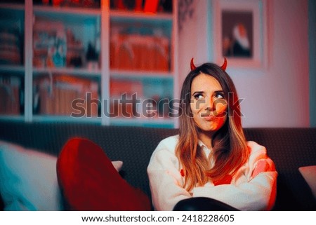 
Funny Mean Girl Wearing Devil Horns Making Malicious Plans. Scheming toxic person being on her own with no one to love 
 Royalty-Free Stock Photo #2418228605