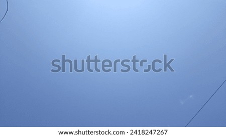 Bright blue sky photo portraying the serene beauty and clear skies of a sunny day