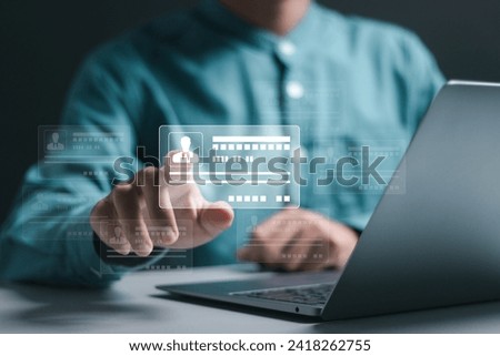 Digital identification or digital ID concept. Businessman use laptop and hand touch virtual screen of digital identification card to accessing databases by digital identity for cyber security.