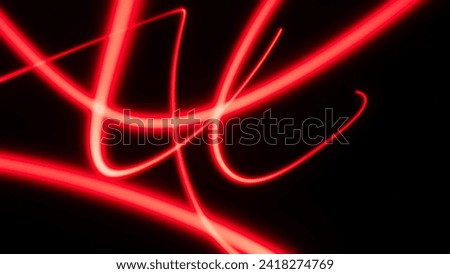 Abstract electric line neon colorful gradient black background. Concept three color red light trail slow shutter speed.