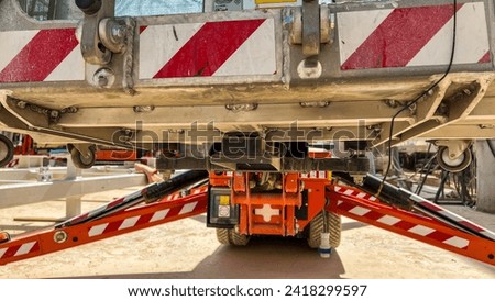 man lift outrigger and outrigger pad  Royalty-Free Stock Photo #2418299597