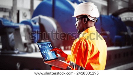 Man Working In Power Plant Electricity Generation Royalty-Free Stock Photo #2418301295