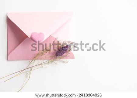 A paper bag with letters such as longevity and celebration written on it to put money in the celebration