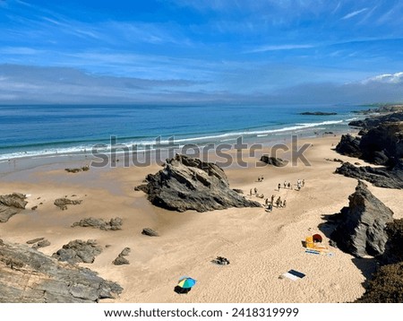 Sandy ocean beach, blue sea horizon, rocky ocean coast, view from the mountains