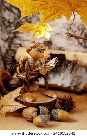Autumn crafts. Children's fall crafts and creativity, Gnome made from acorn and chestnut on dry stump. Ideas for children's art, hometime hobby, daycare education for kids.
