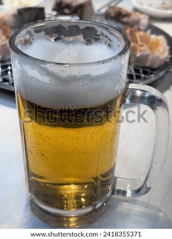 This is a picture of a really delicious 500cc draft beer.